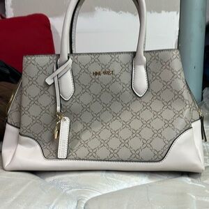 This brand is nine west and nobody has used its clean.